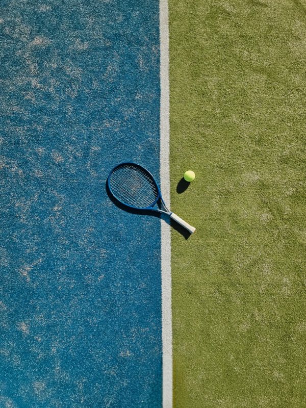 Painted lines where two court colors meet